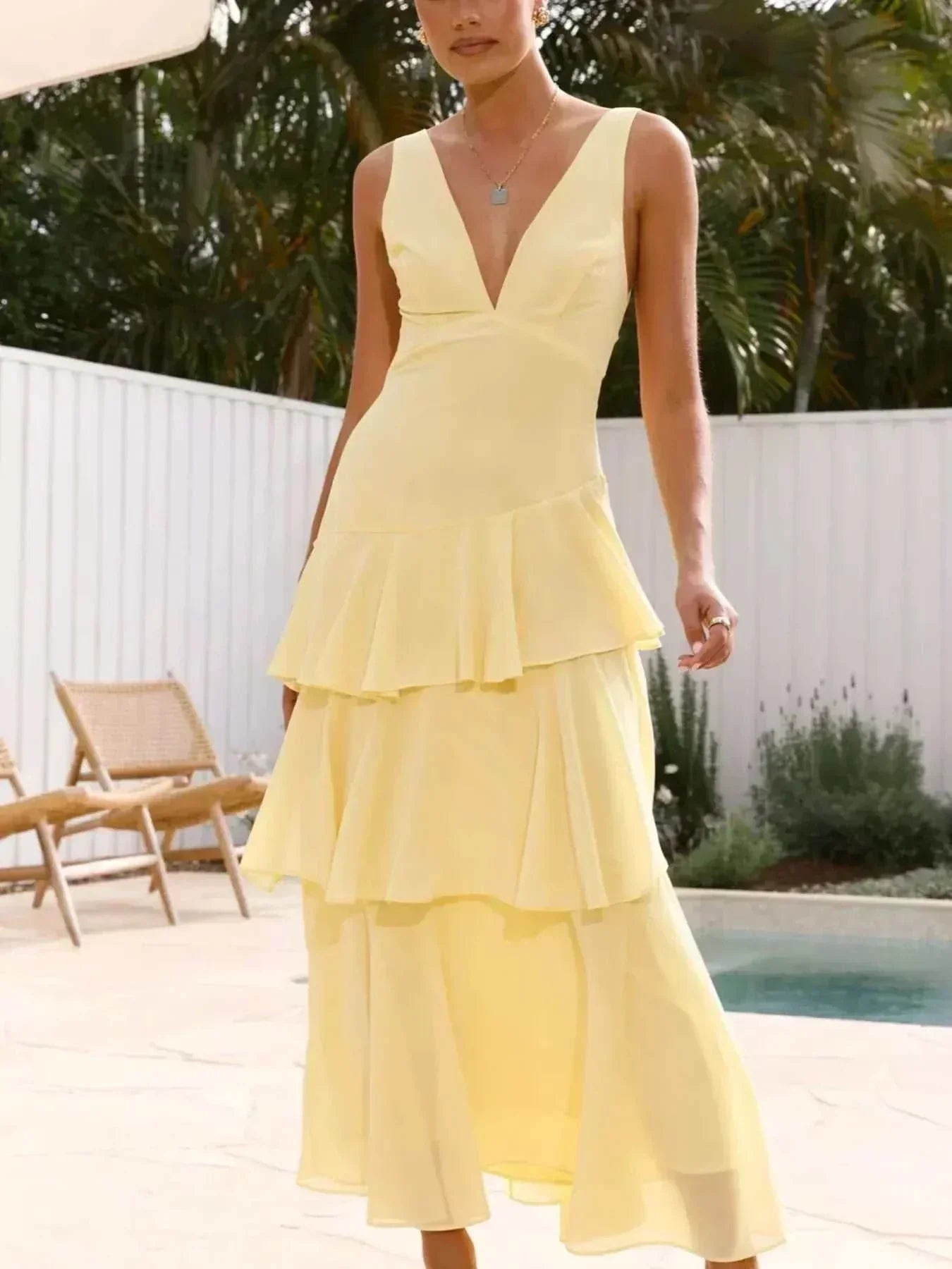 Sleeveless ruffled layered backless maxi dress in polyester with tied details and no stretch