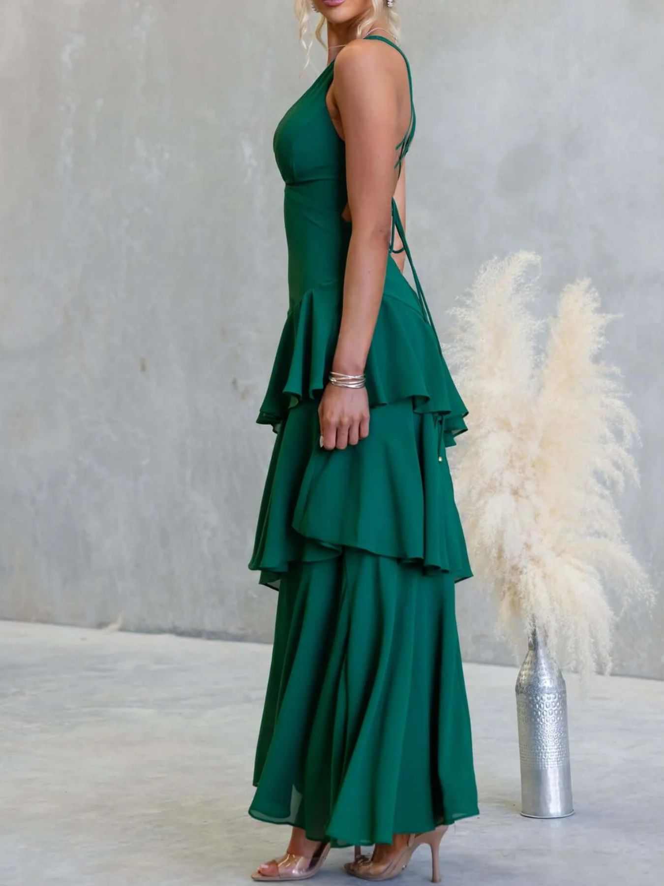 Sleeveless ruffled layered backless maxi dress with tied straps and no stretch polyester fabric