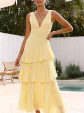 Sleeveless ruffled layered backless maxi dress with tied detail and no stretch polyester fabric
