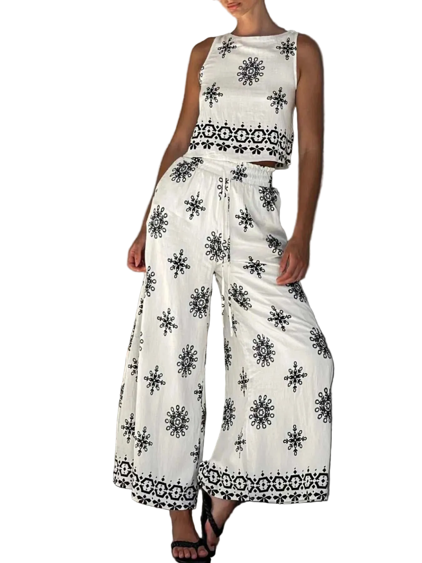 Woman wearing a printed tank and pants set with drawstring waist, made of 100% polyester, two-piece outfit