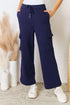 Model wearing RISEN Drawstring relaxed cargo wide leg pants in casual pose