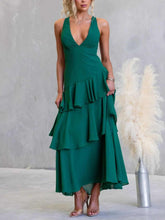 Sleeveless ruffled layered backless maxi dress made of 100% polyester with tied details
