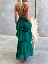 Sleeveless ruffled layered backless maxi dress made of 100% polyester with tied detail and no stretch