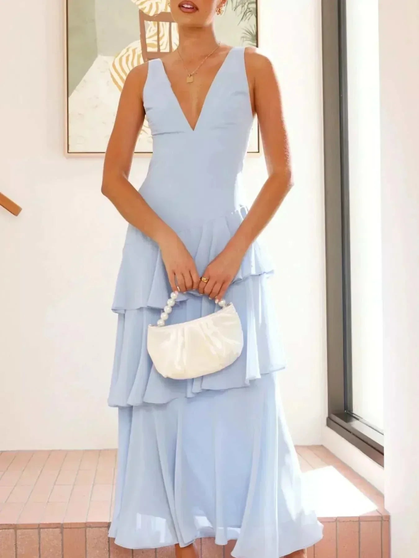 Sleeveless ruffled layered backless maxi dress with tied details in polyester fabric