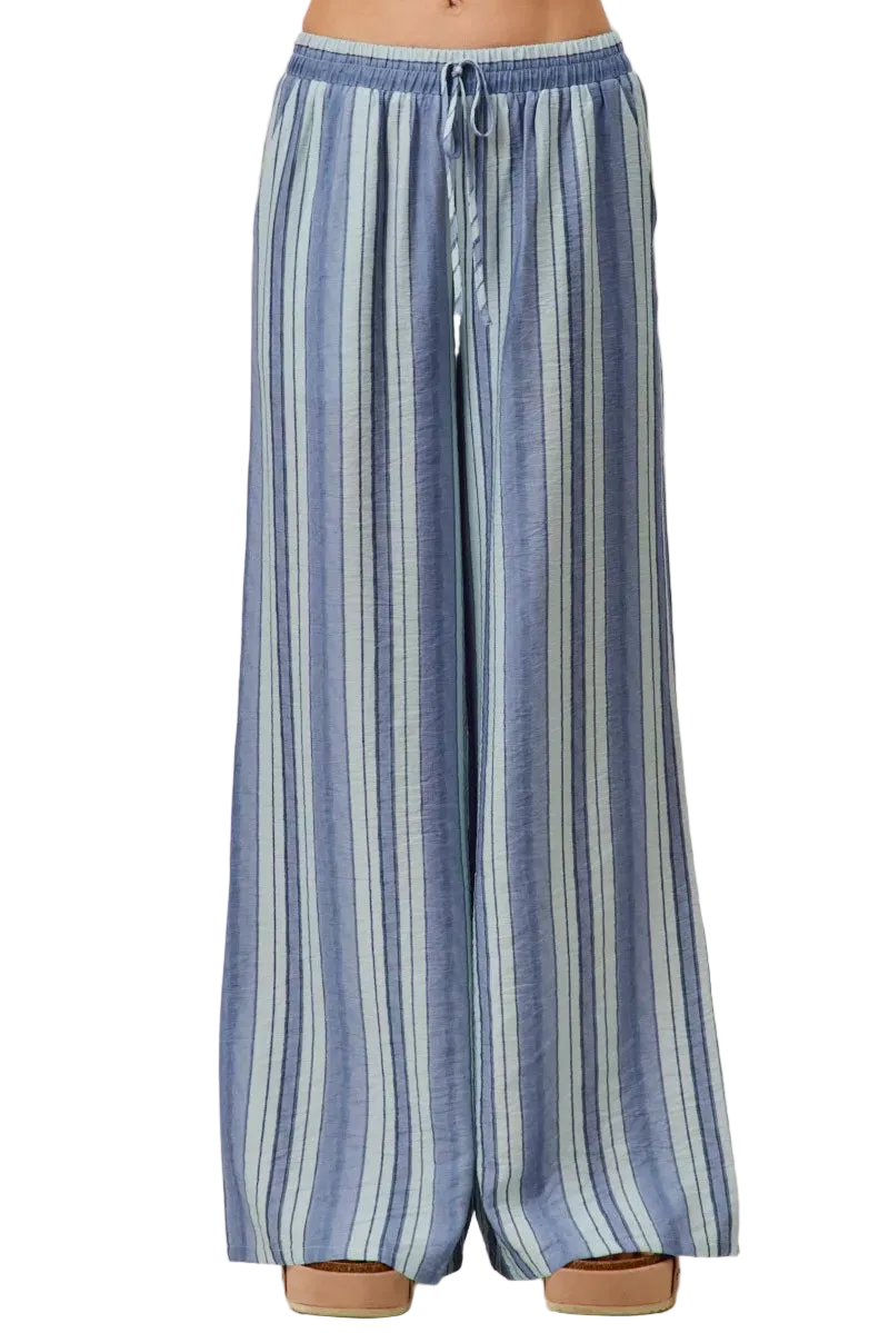 Women wearing SO ME stripe wide leg pull on pants with elastic waist and pockets