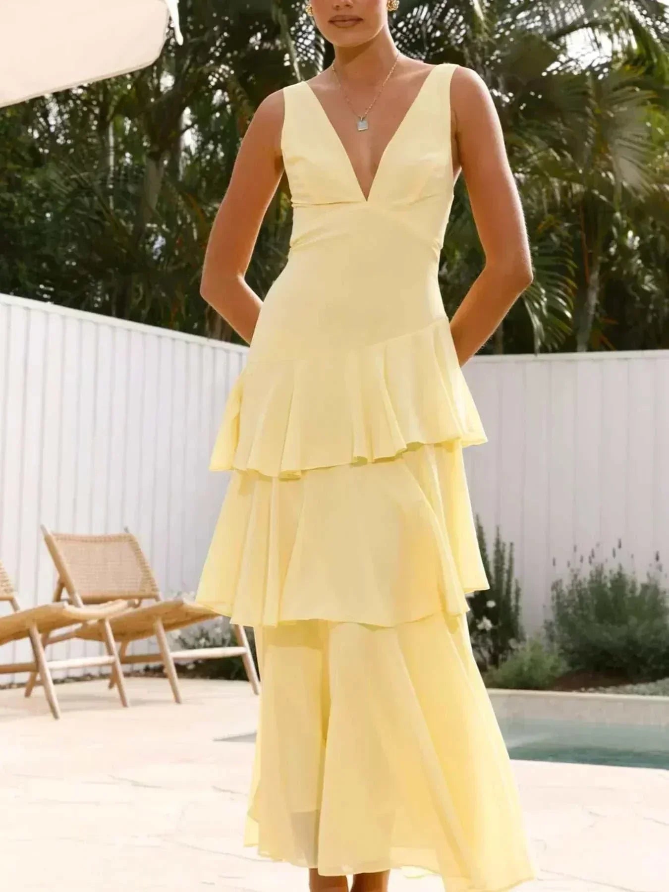 Sleeveless ruffled layered backless maxi dress with tie detail in polyester fabric