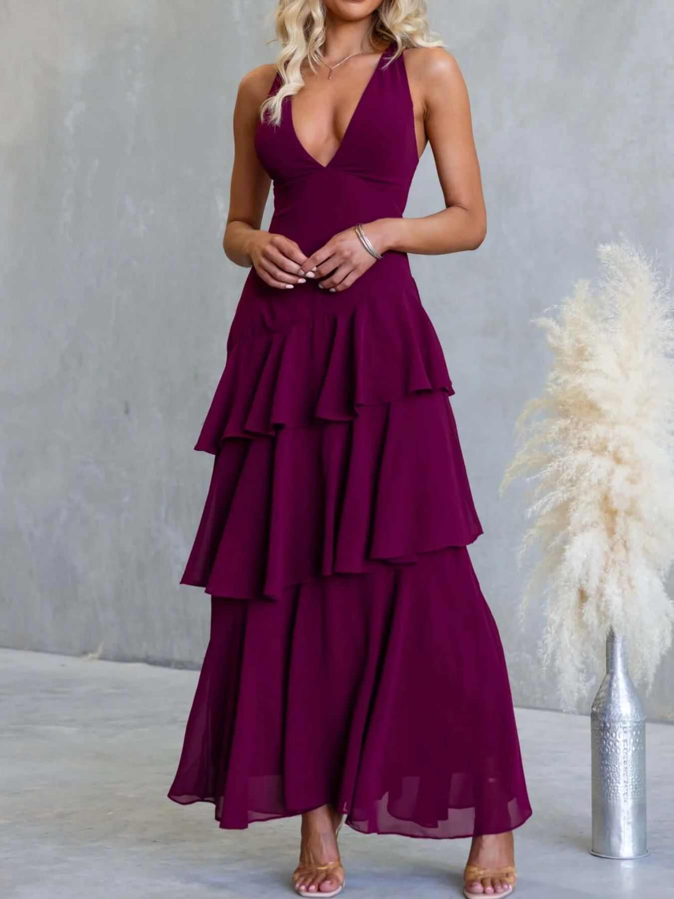 Sleeveless ruffled layered backless maxi dress with tied straps and no stretch polyester fabric