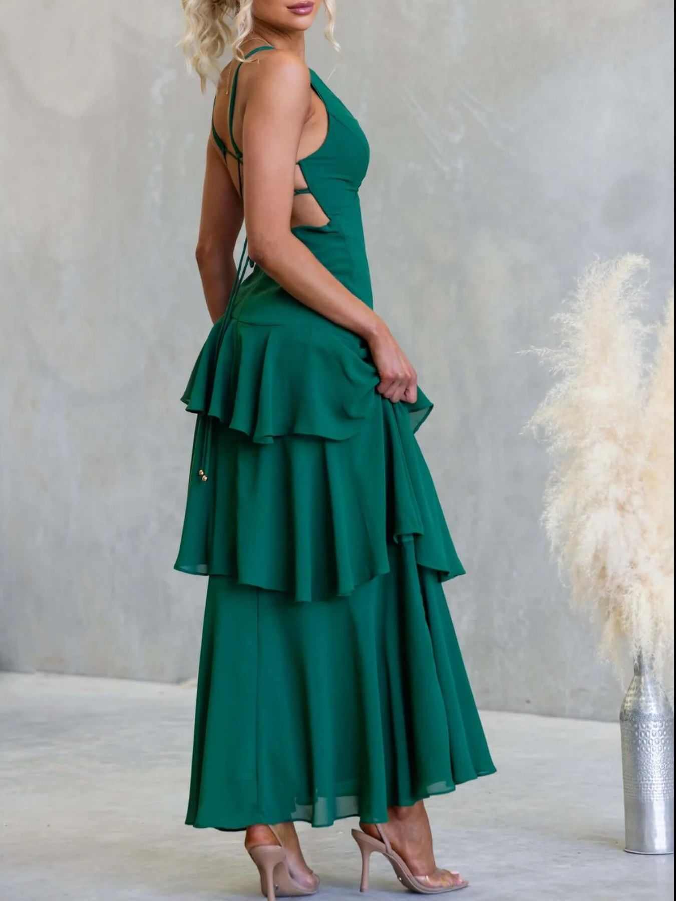 Sleeveless ruffled layered backless maxi dress with tied straps and no stretch polyester fabric